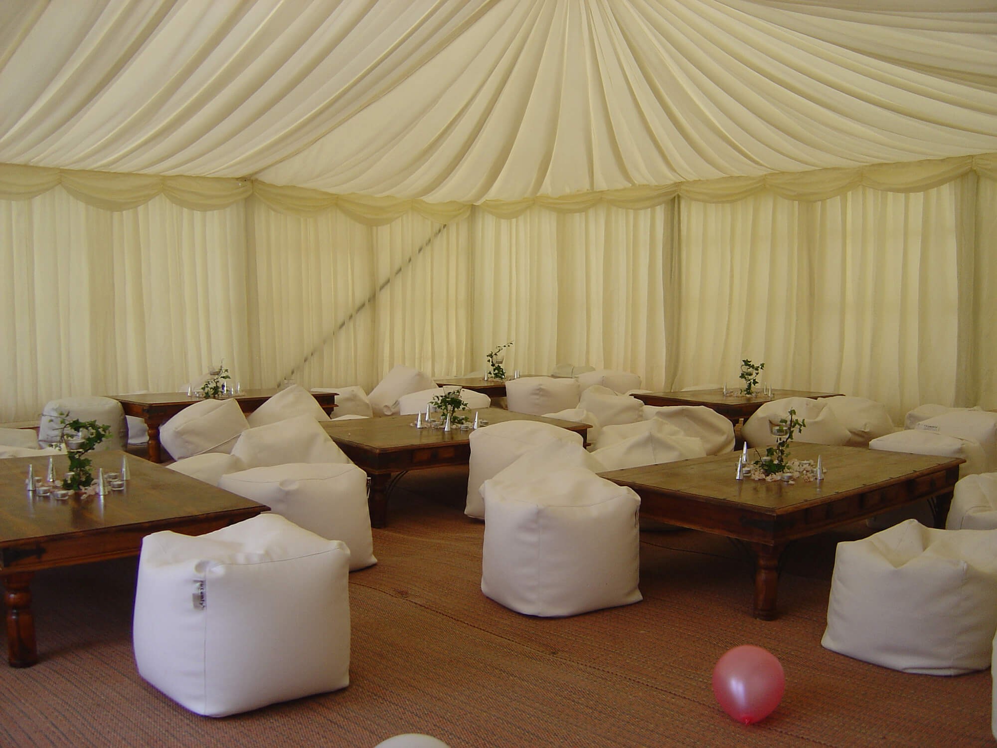 White marquee pitched in an open countryside field